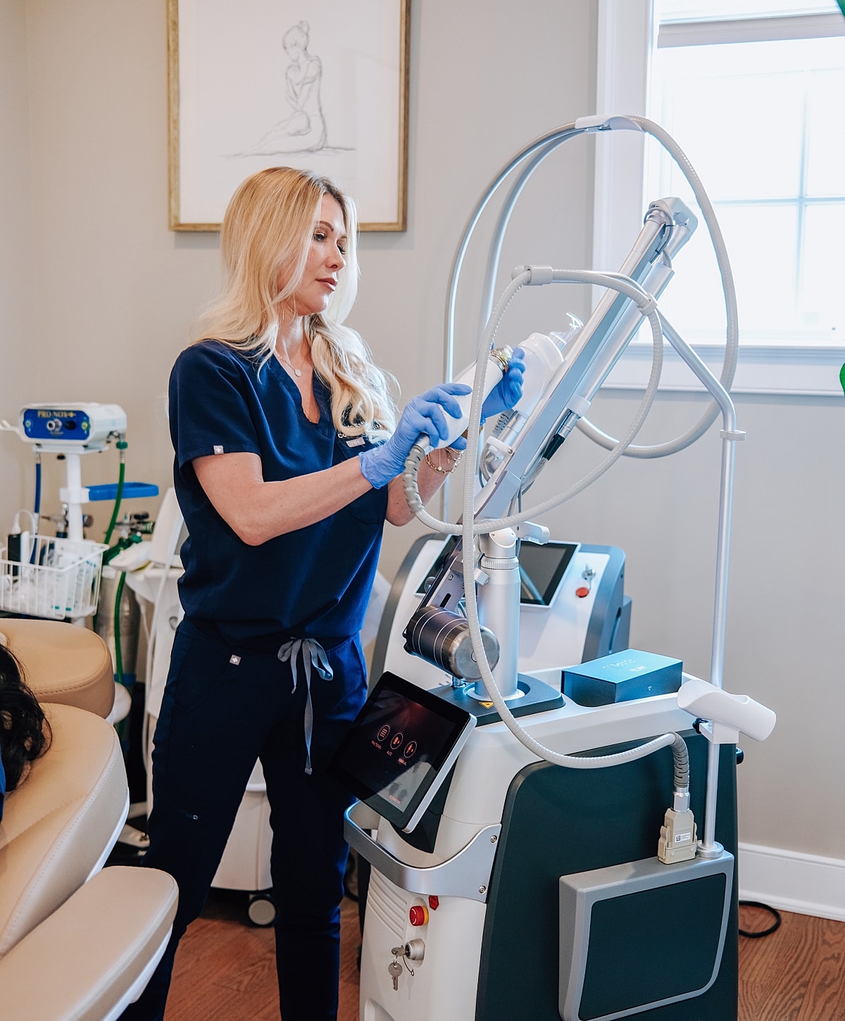 Medical professional using advanced skincare equipment.